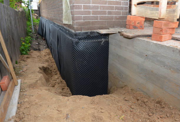 SJ Waterproofing Pros technician performing targeted Exterior Waterproofing assessment in Ringoes, NJ